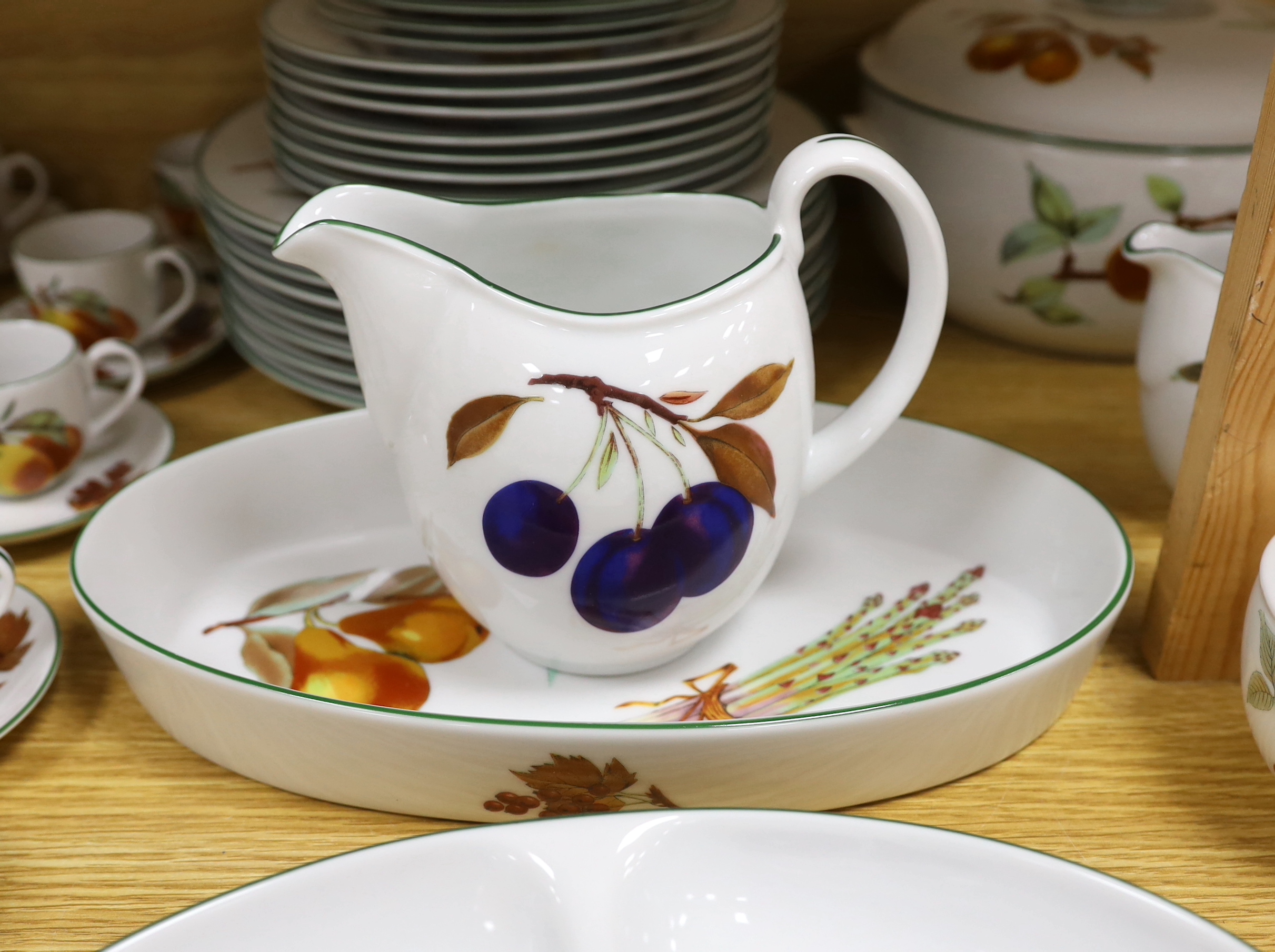 A large quantity of Royal Worcester Evesham Vale serving dishes and dinnerwares